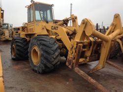 936E wheel loader with logging forks plus a bucket